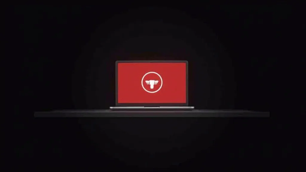 Laptop sa crvenim ekranom i upozorenja ikonom - zastareli veb sajt koji šteti poslovanju